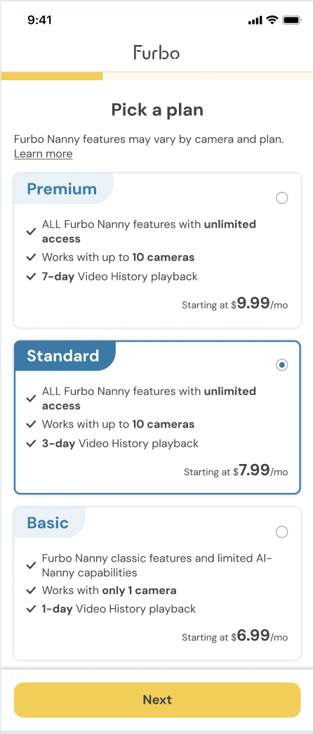 Furbo app screen showing “Pick a plan” with three subscription options: Premium ($9.99/month, unlimited features, up to 10 cameras, 7-day video history), Standard (selected, $7.99/month, unlimited features, up to 10 cameras, 3-day video history), and Basic ($6.99/month, limited features, 1 camera, 1-day video history). A “Next” button appears at the bottom.